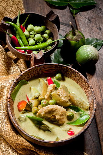 Thai Green Curry With Chicken & Fresh Ingredients As Garnishing.