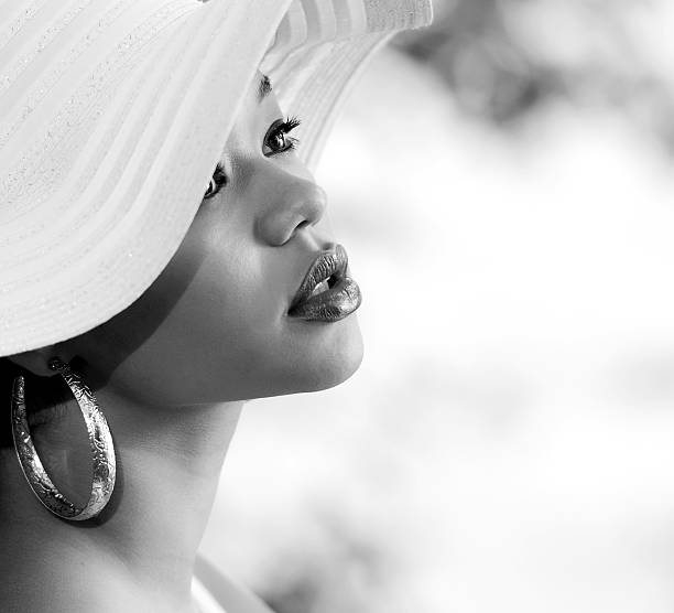 istock Beautiful mixed race woman with white summer hat 183341502