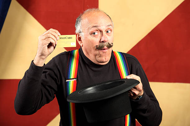 Magician Pulls Credit Card Out Of Hat stock photo