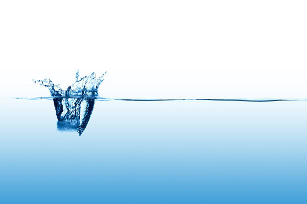 istock Close up abstract of single splash on calm surface 183342969