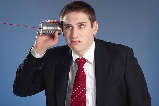 istock Business Man on Tin Can Phone 183343521