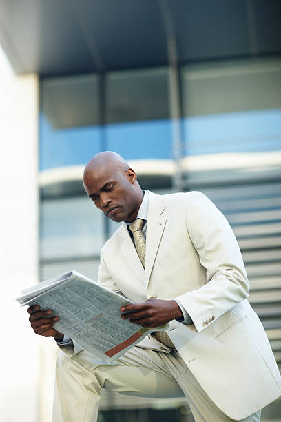 istock Business man reading morning news 183343765