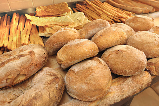 istock Different types of bread and breadsticks just baked 183344519
