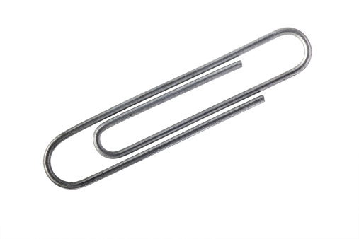 Isolated high resolution metal paper clip with clipping path for easy editing.
