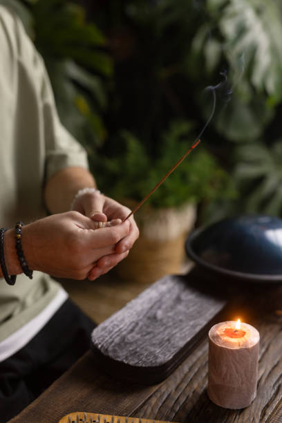 istock Smoke from burning incense sticks standing on lotus incense holder 1833447699