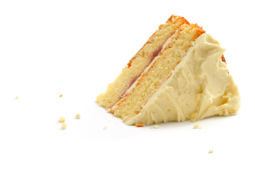A slice of home-made victoria andwich sponge cake isolated on a white background.