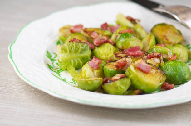 istock White Plate of Sauteed Brussels Sprouts with Bacon 183345173