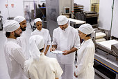 Group of workers in a meeting at an industrial bakery