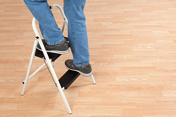 Standing on a Step Ladder stock photo