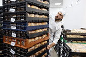 Baker getting packages ready for distribution at an industrial bakery