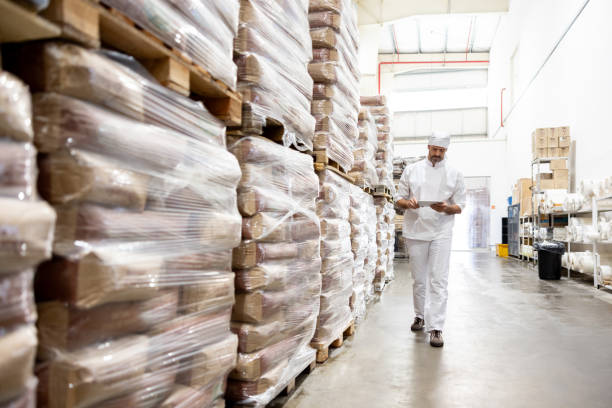 istock Worker taking inventory of the flour at an industrial bakery 1833456862