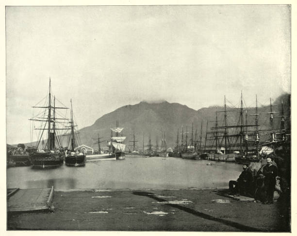 istock Harbour of Cape Town, South Africa, with sailing ships alongside the docks, Victorian 19th Century 1833457442