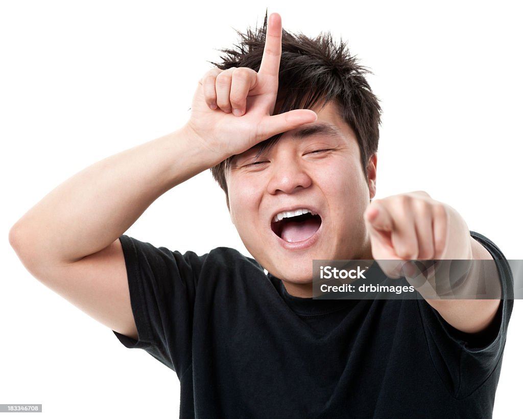 Young Man Gestures Loser L Hand Sign, Laughs, Points Portrait of a young man on a white background. http://s3.amazonaws.com/drbimages/m/ricvo.jpg Sneering Stock Photo