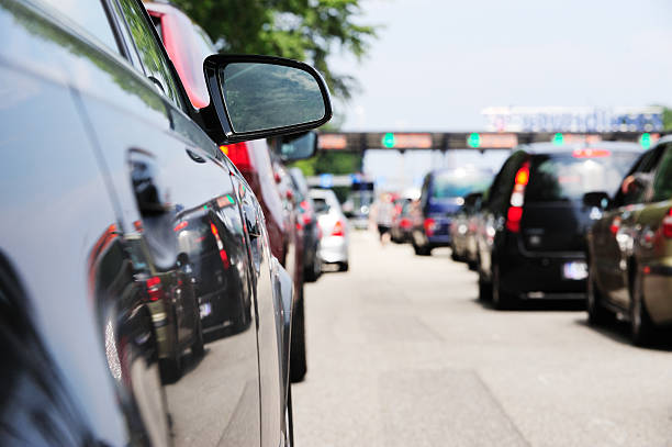 istock Car queues, waiting to pass road toll 183346807