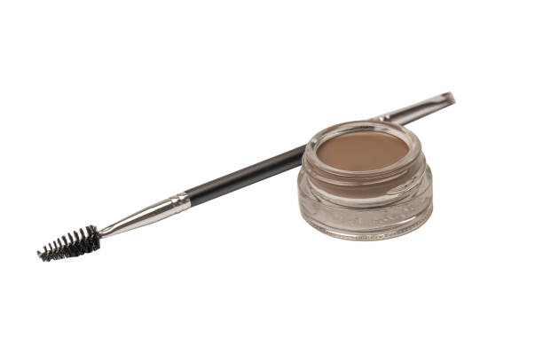 istock A brow pomade in blonde shade with brush isolated on a white background. 1833468359
