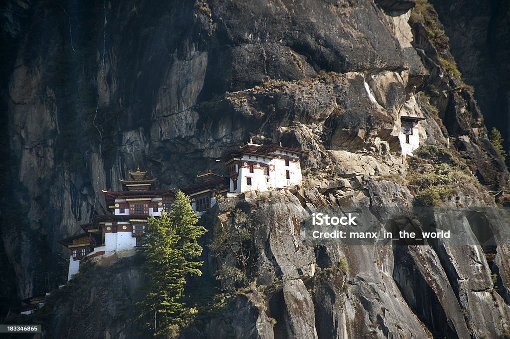 Taktshang, Tiger&#8217;s Nest in Bhutan Taktshang, “the Tiger’s Nest” in the Paro Valley, is one of the most sacred sites in Bhutan.  The monastery clings to the black rock, overhangeing the valley below by 800 meters (2.600 feet) Animal Nest Stock Photo