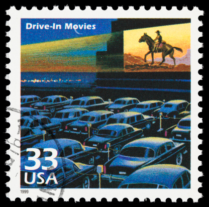 United States postage stamp depicting a 1950's drive-in movie theater.