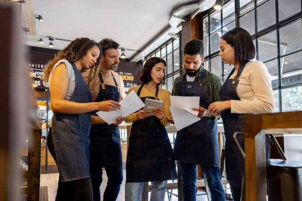 istock Staff sharing ideas in a business meeting at a cafe 1833475945