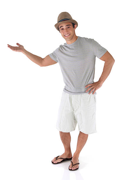 istock Isolated casual man with his hand out presenting 183347652