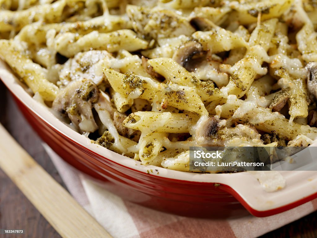 Creamy Baked Pesto Chicken, Mushroom and Penne Casserole "Creamy Baked Pesto Chicken, Mushroom and Penne Casserole -Photographed on Hasselblad H3D-39mb Camera" Baked Stock Photo