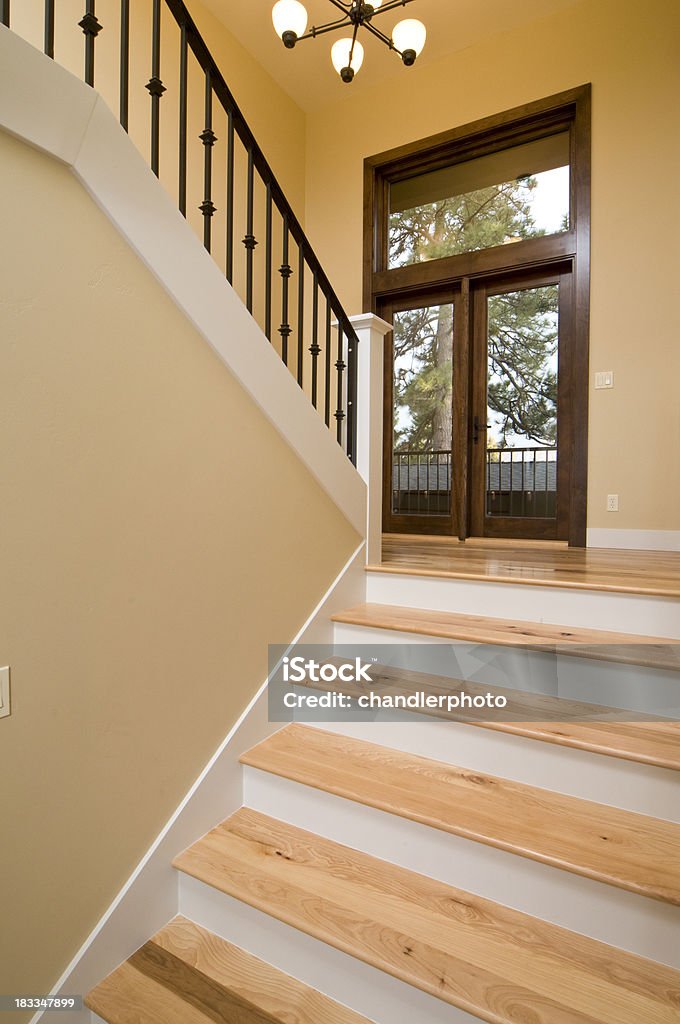 Modern wooden staircase This modern staircase is wooden with metal railing. Architectural Feature Stock Photo