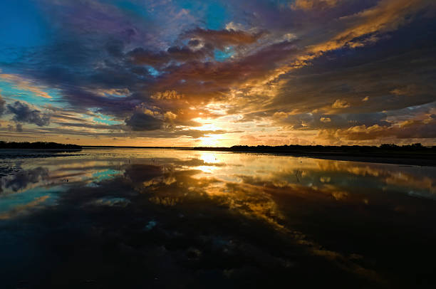 istock Dramatic sky reflection on a Tropical coastal lagoon at sunrise 183348225