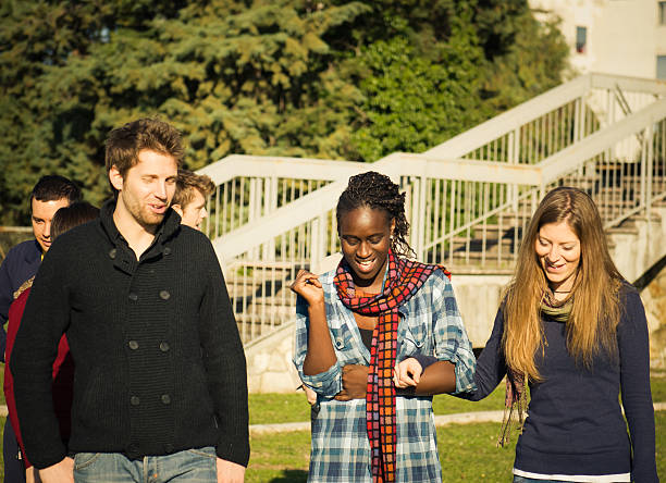 istock University students having a great time outdoors 183348439