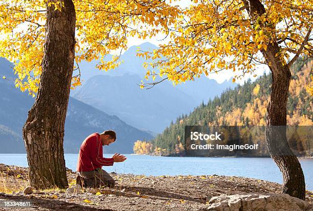 Lakeside Meditation Stock Photo - Download Image Now - Praying, Kneeling, One Person