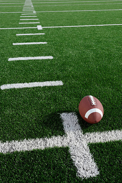 istock A football sitting on a yard-line on a field 183348729