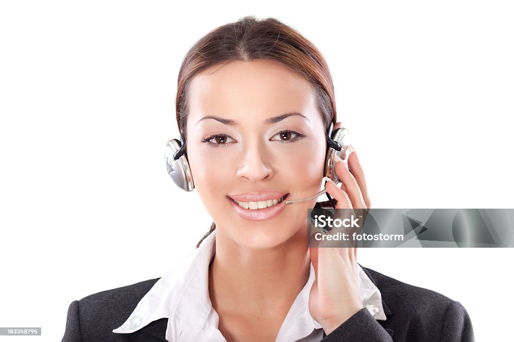 Technical support - smiling young buiness woman with headphones Technical support - smiling young buiness woman with headphones and microphone. Adult Stock Photo