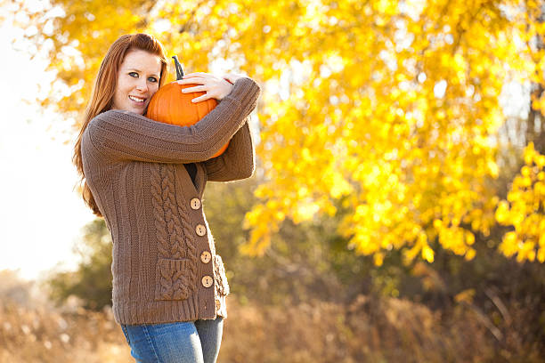 istock Autumn Woman with Pumpkin 183348893