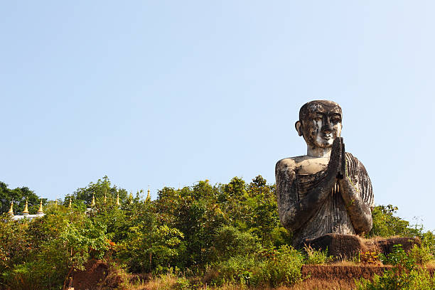istock greeting Buddha statue and golden pagodas 183349646