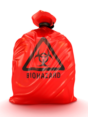 Red biohazard bag isolated on white.