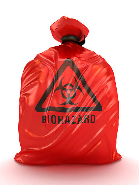 Biohazard bags Red biohazard bag isolated on white. biohazard symbol stock pictures, royalty-free photos & images