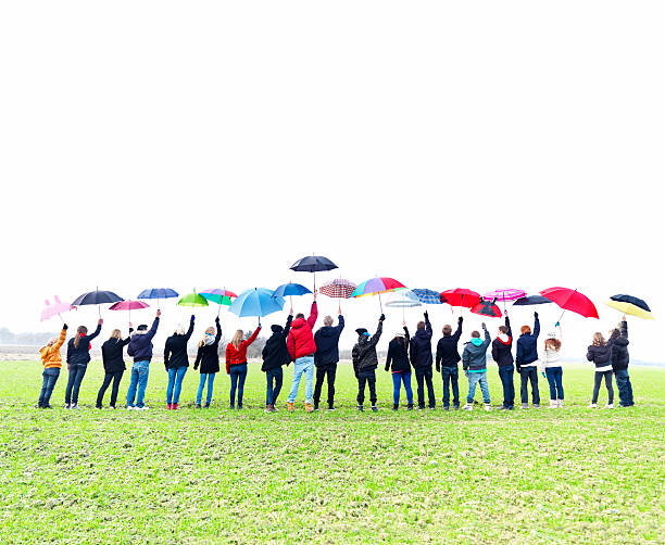 istock Rear view image of kids raising their umbrella 183350166