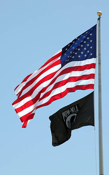 istock US & POW-MIA Flags unfurled 183350583