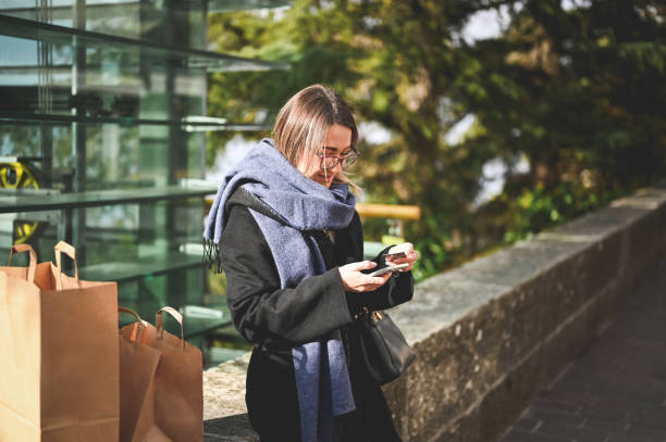 istock Shopaholic making online payment outdoors. 1833506327