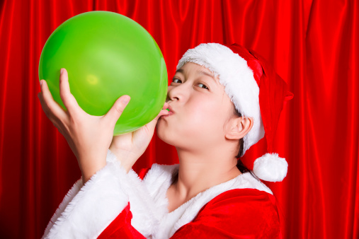 Women Blowing Balloons On Christmas Day