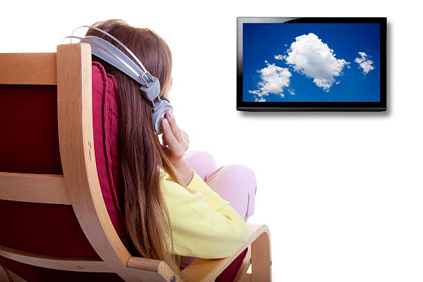 istock Watching Tv with Earphone 183351152