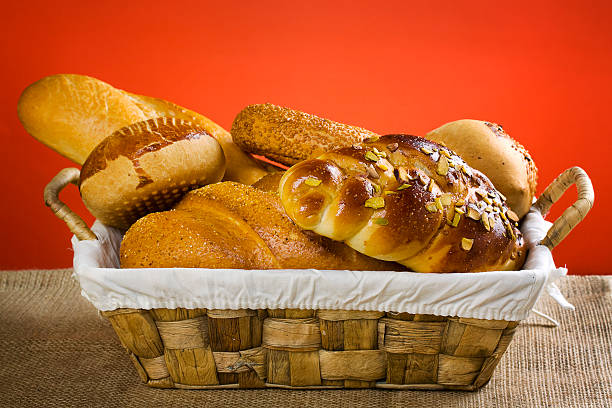 Basket with Pastries Different types of pastries savories and breads on basket bread bun corn bread basket stock pictures, royalty-free photos & images