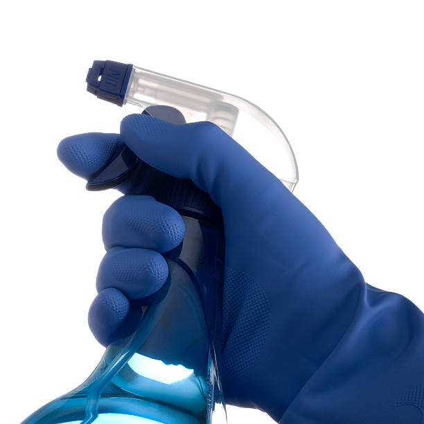 istock Hand with rubber glove and cleaning product 183351197