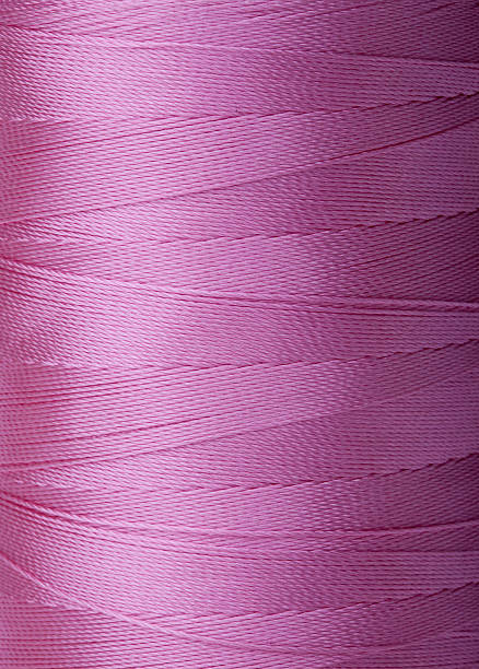 istock Detail of violet spool thread 183351345