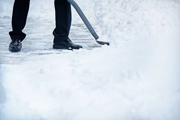 istock Man removing snow with shovel 183351566