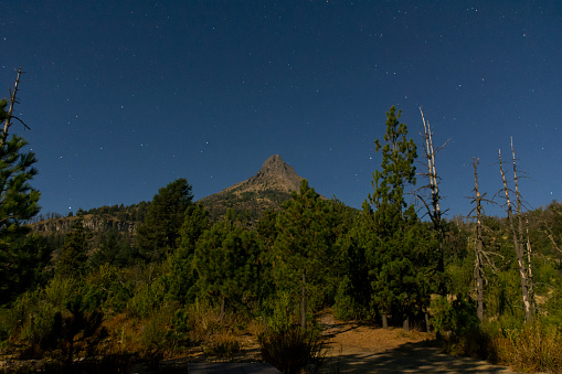 The summit of the nevado de colima on a full moon night.