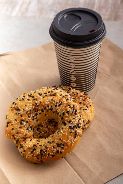 istock Poppy seed bagel served with coffee to go 1833519492