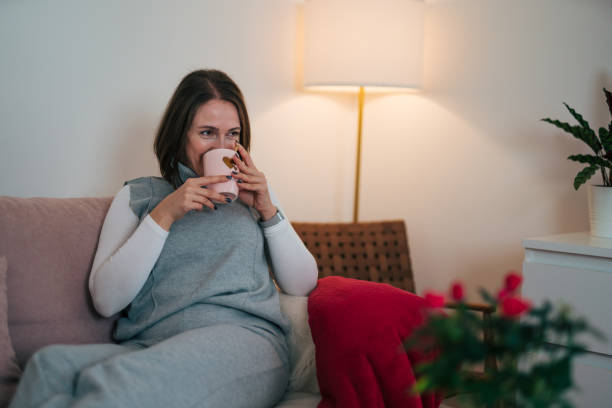 istock Young women on couch 1833520035