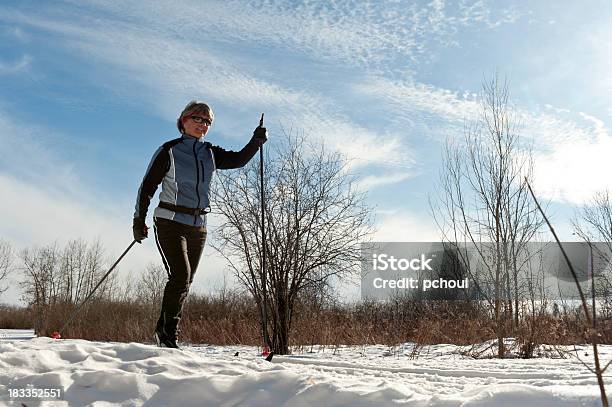 Happy Woman Crosscountry Skiing Winter Sport Stock Photo - Download Image Now - 30-39 Years, Active Lifestyle, Activity