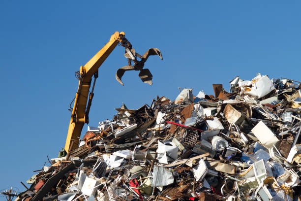 istock Crane With Open Claw, Metal Recycling Junkyard, Blue Sky 183352662