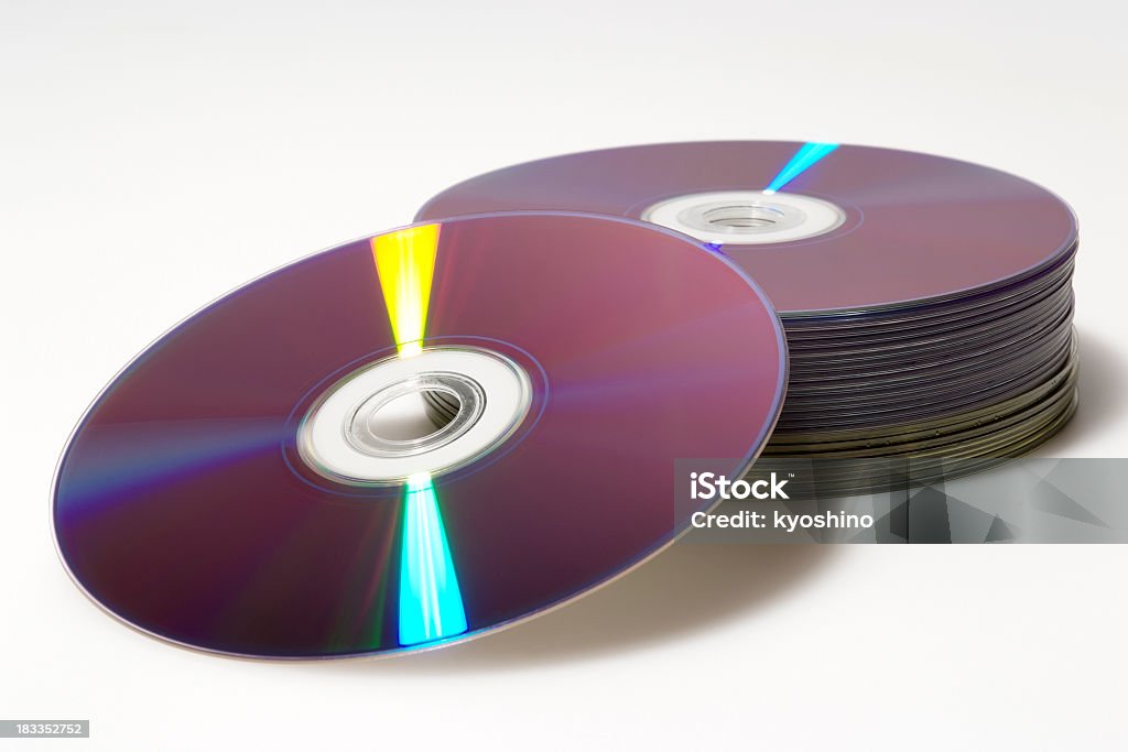 絶縁ショットのスタックド DVD 、スペクトルに白背景 - CD-ROMのロイヤリティフリーストックフォト