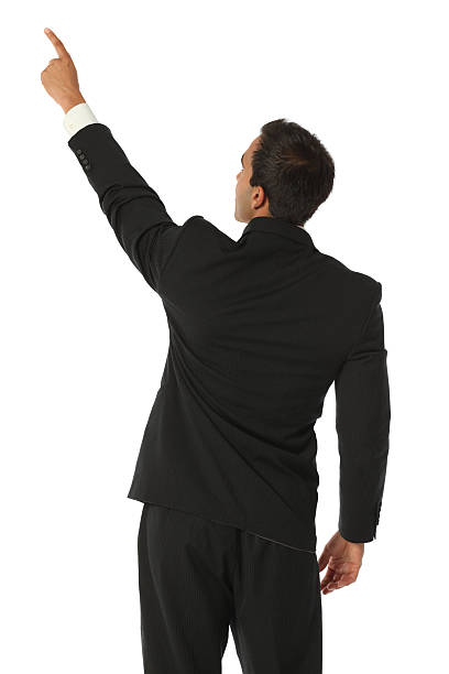 istock Rear view of a businessman pointing 183353592